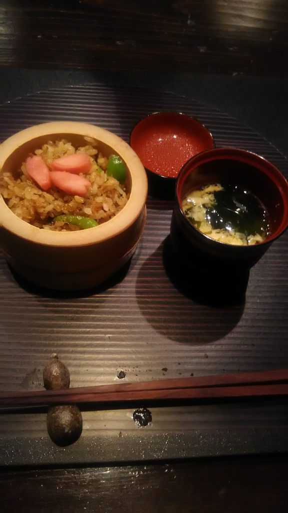 rice and soup with chopsticks